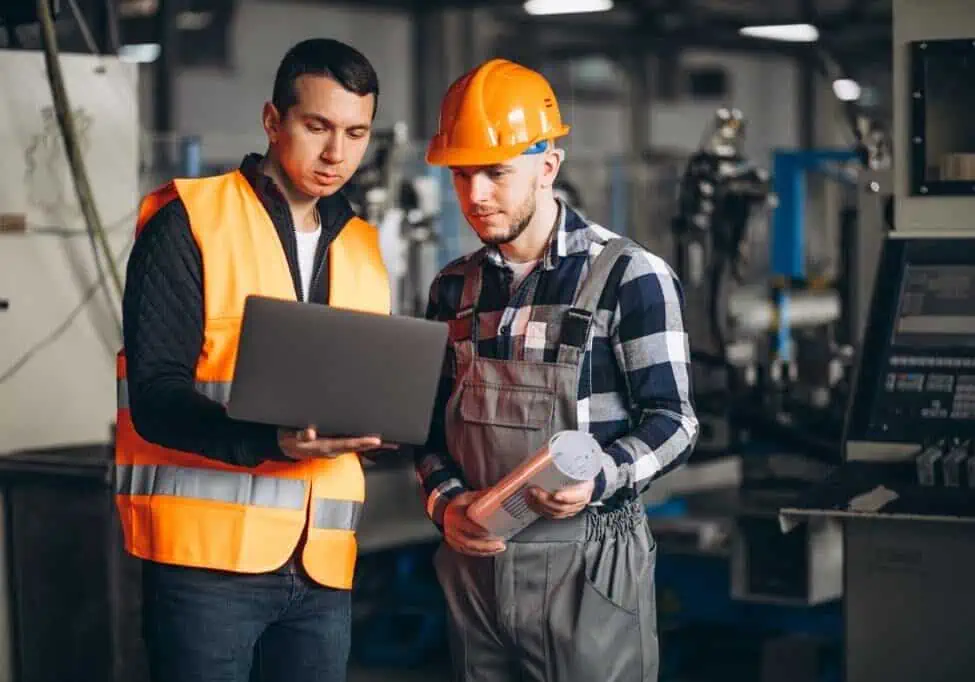 two colleagues at factory landscape